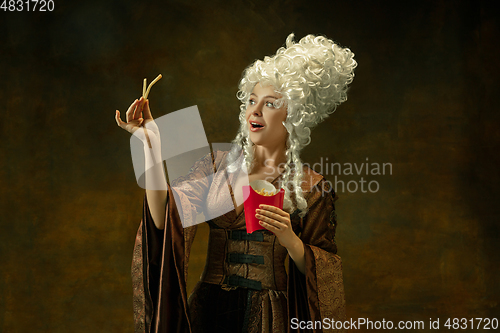 Image of Medieval young woman in old-fashioned costume