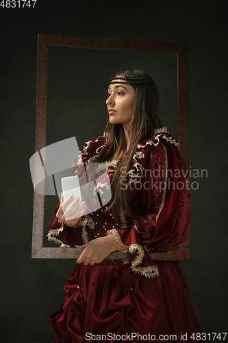 Image of Medieval young woman in old-fashioned costume