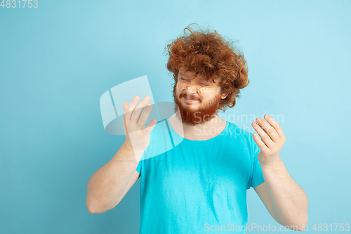 Image of Portrait of young caucasian man in his beauty day and skin care routine