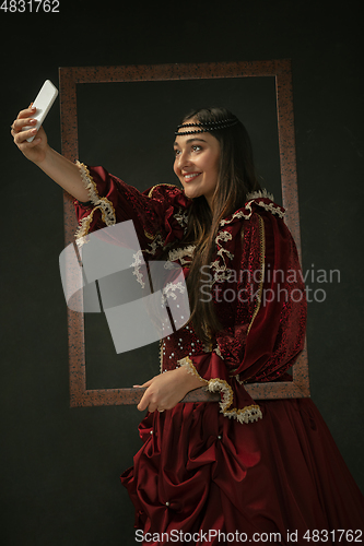 Image of Medieval young woman in old-fashioned costume