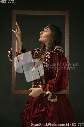 Image of Medieval young woman in old-fashioned costume