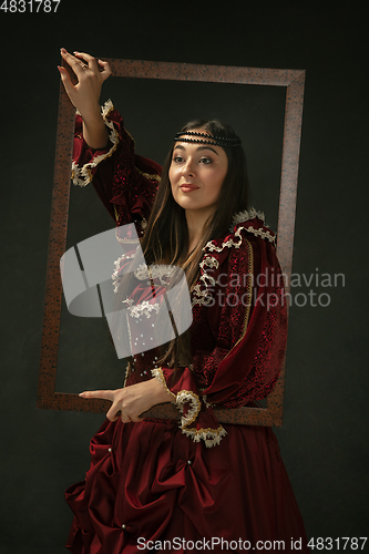 Image of Medieval young woman in old-fashioned costume