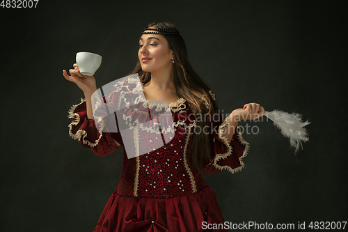 Image of Medieval young woman in old-fashioned costume