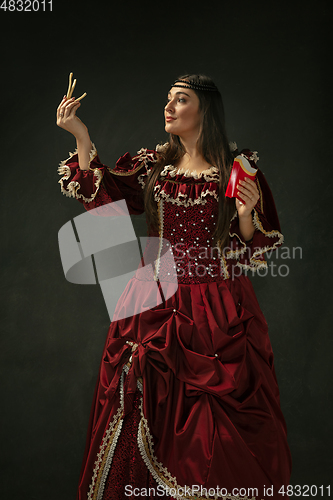 Image of Medieval young woman in old-fashioned costume