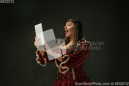 Image of Medieval young woman in old-fashioned costume