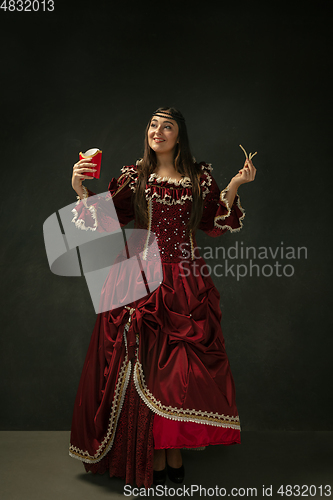 Image of Medieval young woman in old-fashioned costume