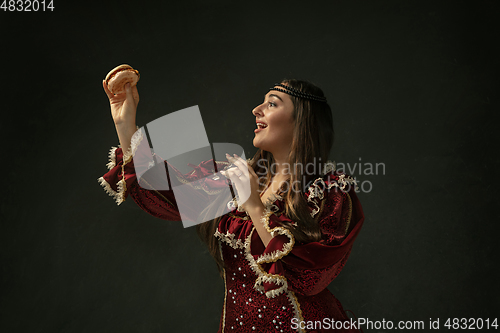 Image of Medieval young woman in old-fashioned costume