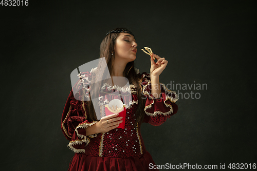 Image of Medieval young woman in old-fashioned costume