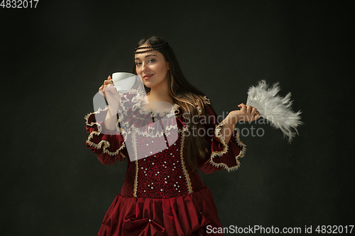 Image of Medieval young woman in old-fashioned costume