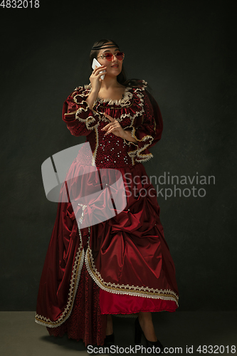 Image of Medieval young woman in old-fashioned costume