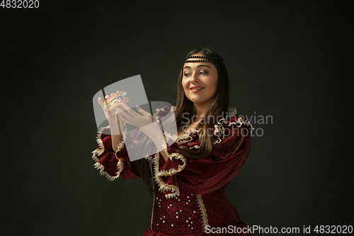 Image of Medieval young woman in old-fashioned costume