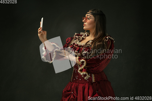 Image of Medieval young woman in old-fashioned costume