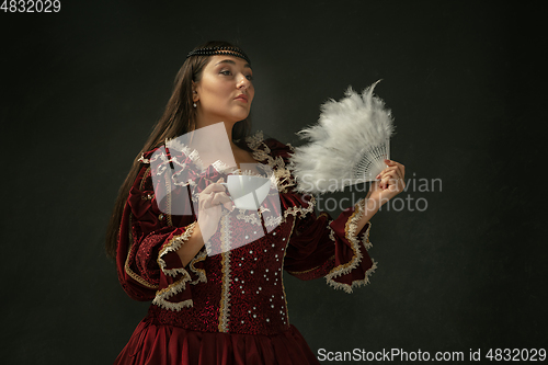 Image of Medieval young woman in old-fashioned costume