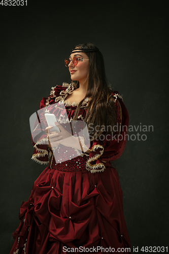 Image of Medieval young woman in old-fashioned costume