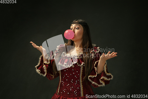 Image of Medieval young woman in old-fashioned costume