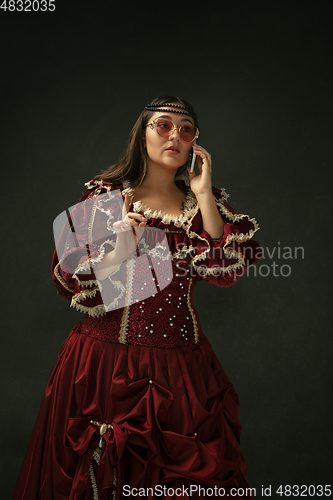 Image of Medieval young woman in old-fashioned costume