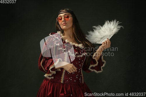 Image of Medieval young woman in old-fashioned costume