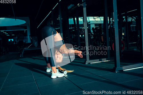 Image of The female athlete training hard in the gym. Fitness and healthy life concept.