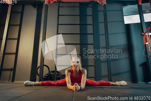 Image of The female athlete training hard in the gym. Fitness and healthy life concept.