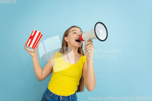 Image of Caucasian teen girl portrait isolated on blue studio background