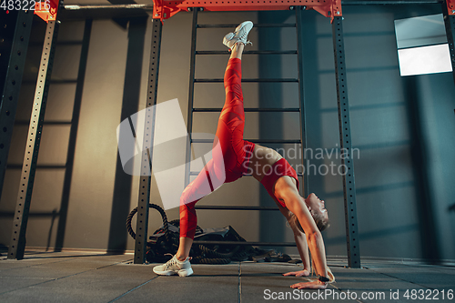 Image of The female athlete training hard in the gym. Fitness and healthy life concept.