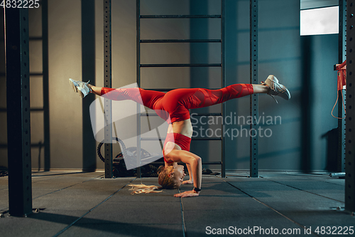 Image of The female athlete training hard in the gym. Fitness and healthy life concept.