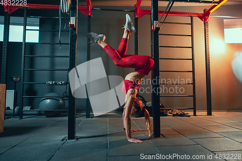 Image of The female athlete training hard in the gym. Fitness and healthy life concept.