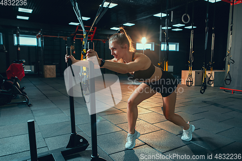 Image of The female athlete training hard in the gym. Fitness and healthy life concept.