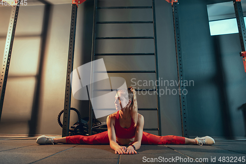 Image of The female athlete training hard in the gym. Fitness and healthy life concept.