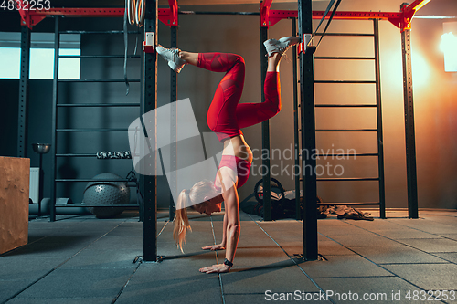 Image of The female athlete training hard in the gym. Fitness and healthy life concept.