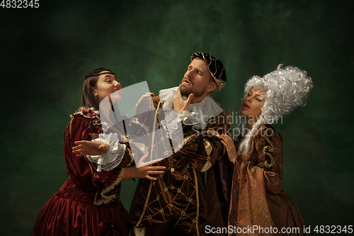 Image of Medieval young man and women in old-fashioned costume