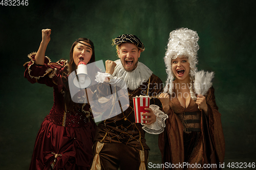 Image of Medieval young man and women in old-fashioned costume