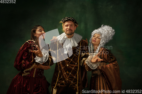 Image of Medieval young man and women in old-fashioned costume