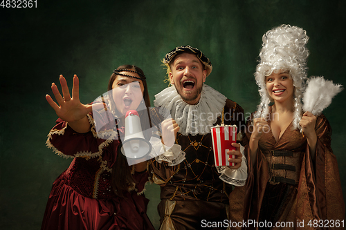 Image of Medieval young man and women in old-fashioned costume