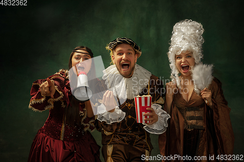 Image of Medieval young man and women in old-fashioned costume