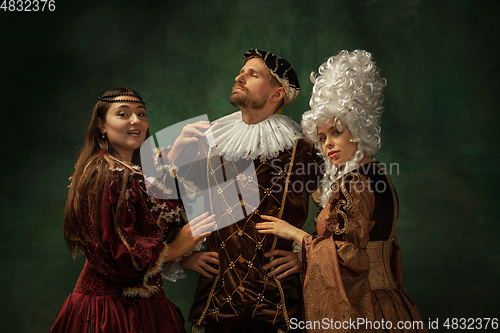 Image of Medieval young man and women in old-fashioned costume