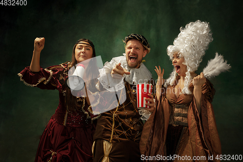 Image of Medieval young man and women in old-fashioned costume