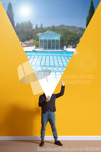 Image of Young caucasian man with smartphone, opening world using his gadget