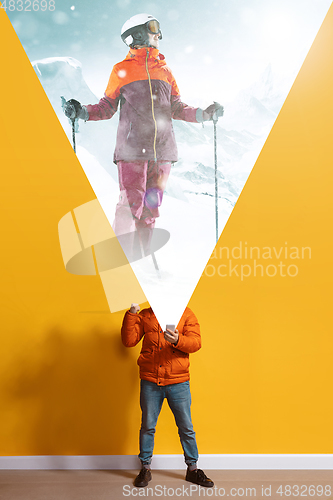 Image of Young caucasian man with smartphone, opening world using his gadget