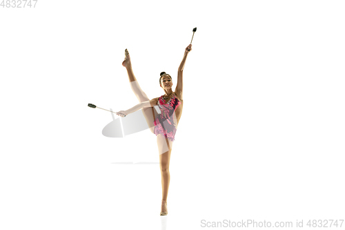 Image of Young flexible female gymnast isolated on white studio background