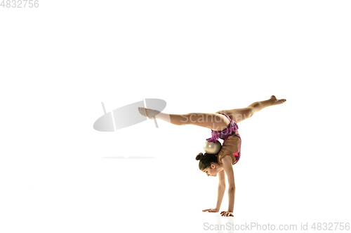 Image of Young flexible female gymnast isolated on white studio background