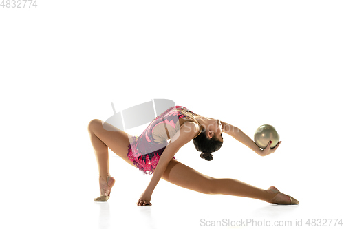 Image of Young flexible female gymnast isolated on white studio background