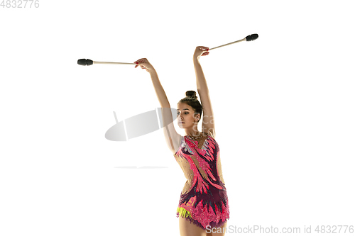 Image of Young flexible female gymnast isolated on white studio background