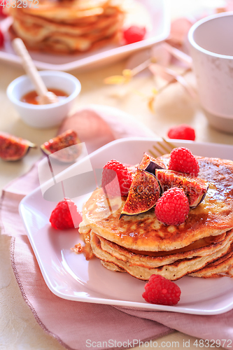 Image of Sweet curd cheese pancakes with fresh raspberry, figs and maple 