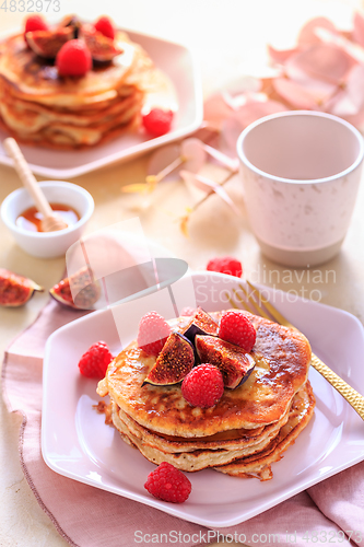 Image of Sweet curd cheese pancakes with fresh raspberry, figs and maple sirup