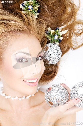 Image of lovely woman with christmas balls