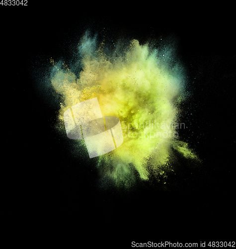 Image of Explosion of colored, fluid and neoned powder on black studio background with copyspace