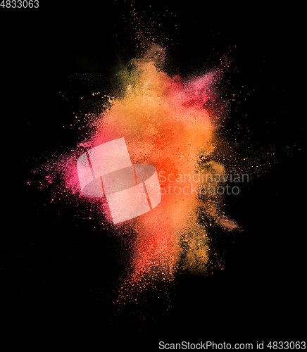 Image of Explosion of colored, fluid and neoned powder on black studio background with copyspace