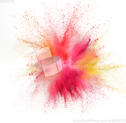 Image of Explosion of colored, fluid and neoned powder on white studio background with copyspace