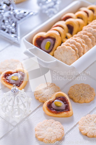 Image of Homemade Christmas cookies with ornaments in white